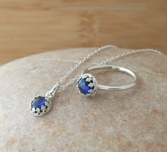 Small ethical blue sapphire princess crown pendant necklace and ring in sustainable sterling silver. Handmade in New Jersey, US