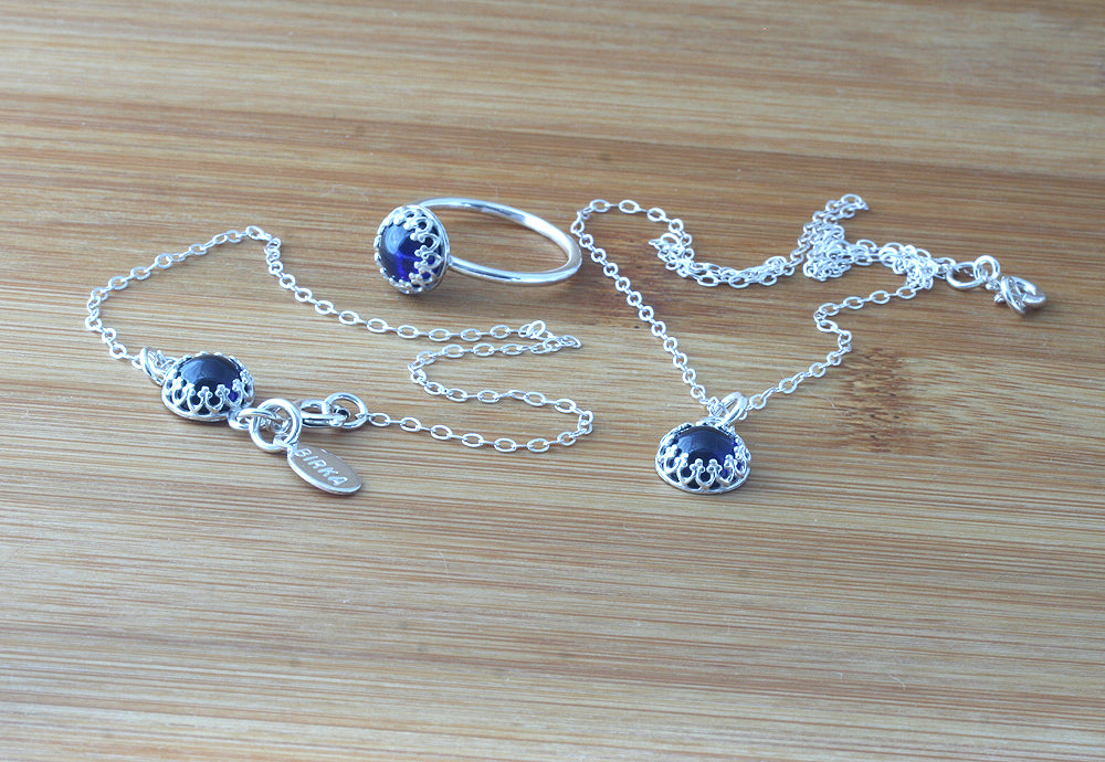 Ethical blue sapphire bracelet, ring, and necklace in sterling silver. Handmade in the US.