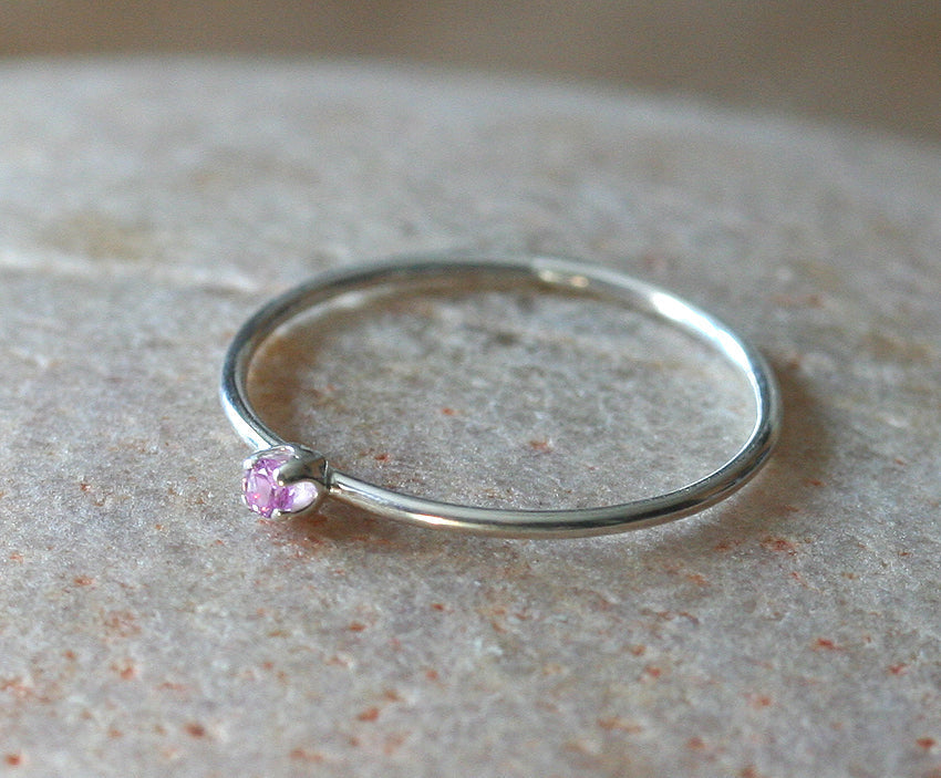 Thin faceted birthstone pink sapphire stacking rings in sustainable silver. Handmade in New Jersey, US.
