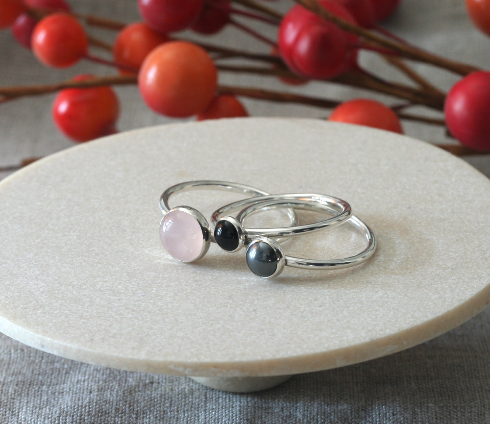 Classic rose quartz, black onyx, and hematite stacking rings handmade in New Jersey with sustainable silver.