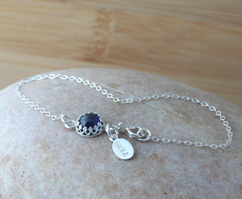 Ethical blue sapphire crown bracelet in sterling silver. Handmade in the US.
