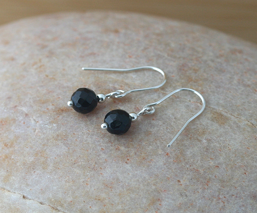 Faceted black onyx dangle earrings in sustainable sterling silver. Handmade in New Jersey, US. 