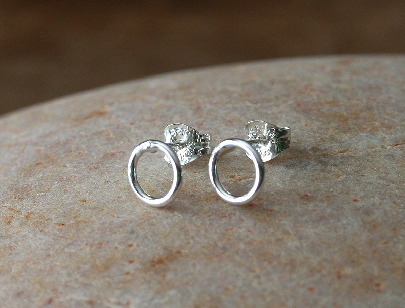 Tiny circle stud earrings in sustainable sterling silver. Handmade in New Jersey, US.