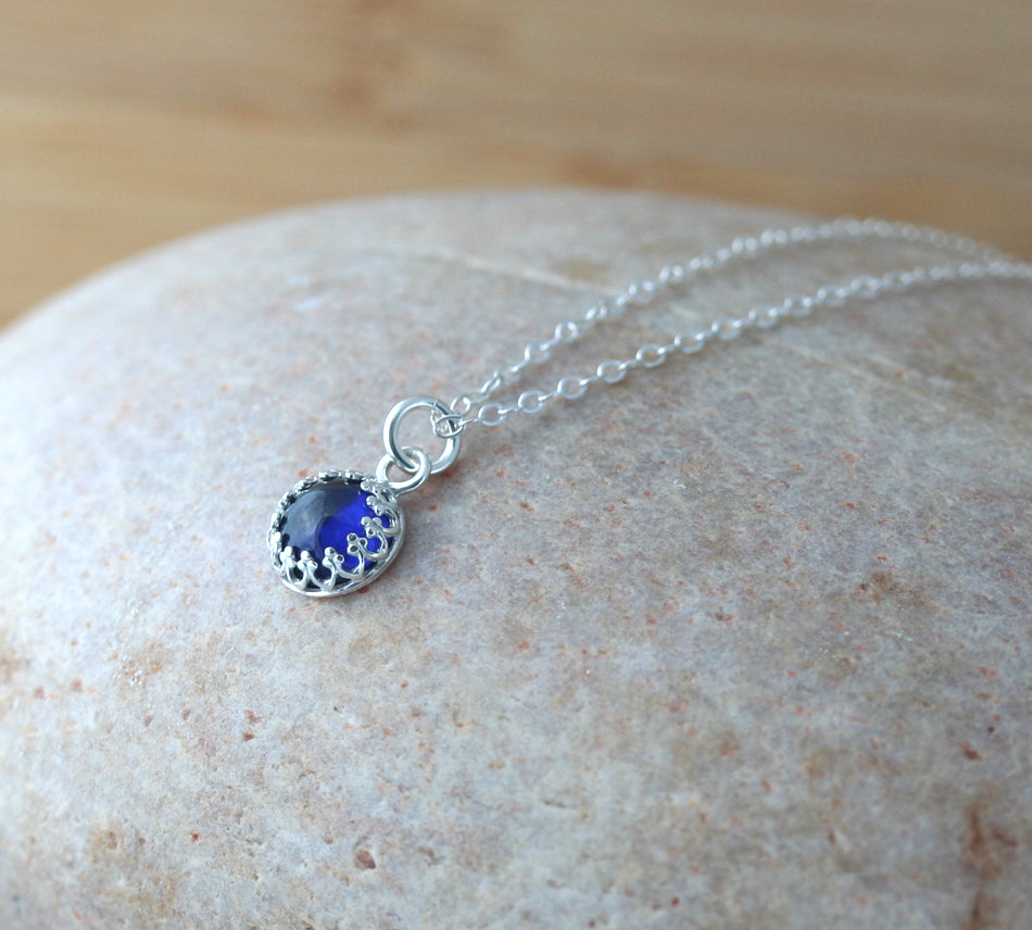 Minimalist ethical blue sapphire princess crown pendant necklace in sustainable sterling silver. Handmade in New Jersey, US.