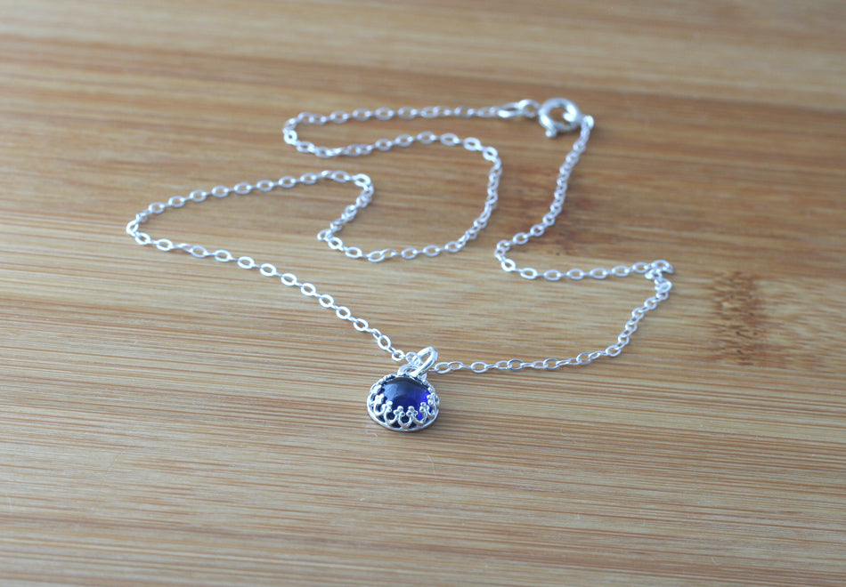 Minimalist ethical blue sapphire princess crown pendant necklace in sustainable sterling silver. Handmade in New Jersey, US.