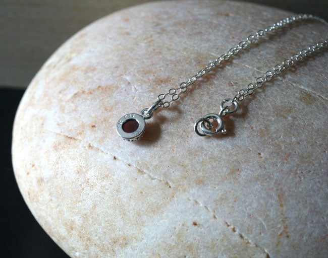 Small garnet princess crown pendant necklace in sustainable sterling silver. Handmade in New Jersey, US.