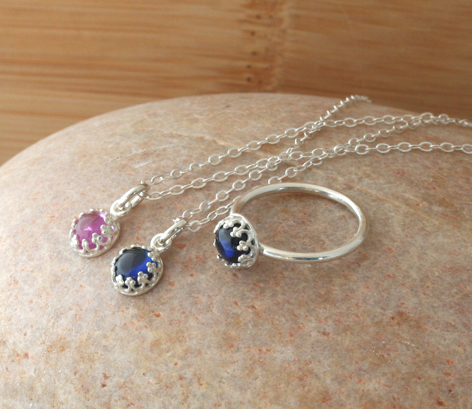 Small pink and blue sapphire princess crown necklace in sustainable sterling silver. Ethical. Handmade in New Jersey, US.