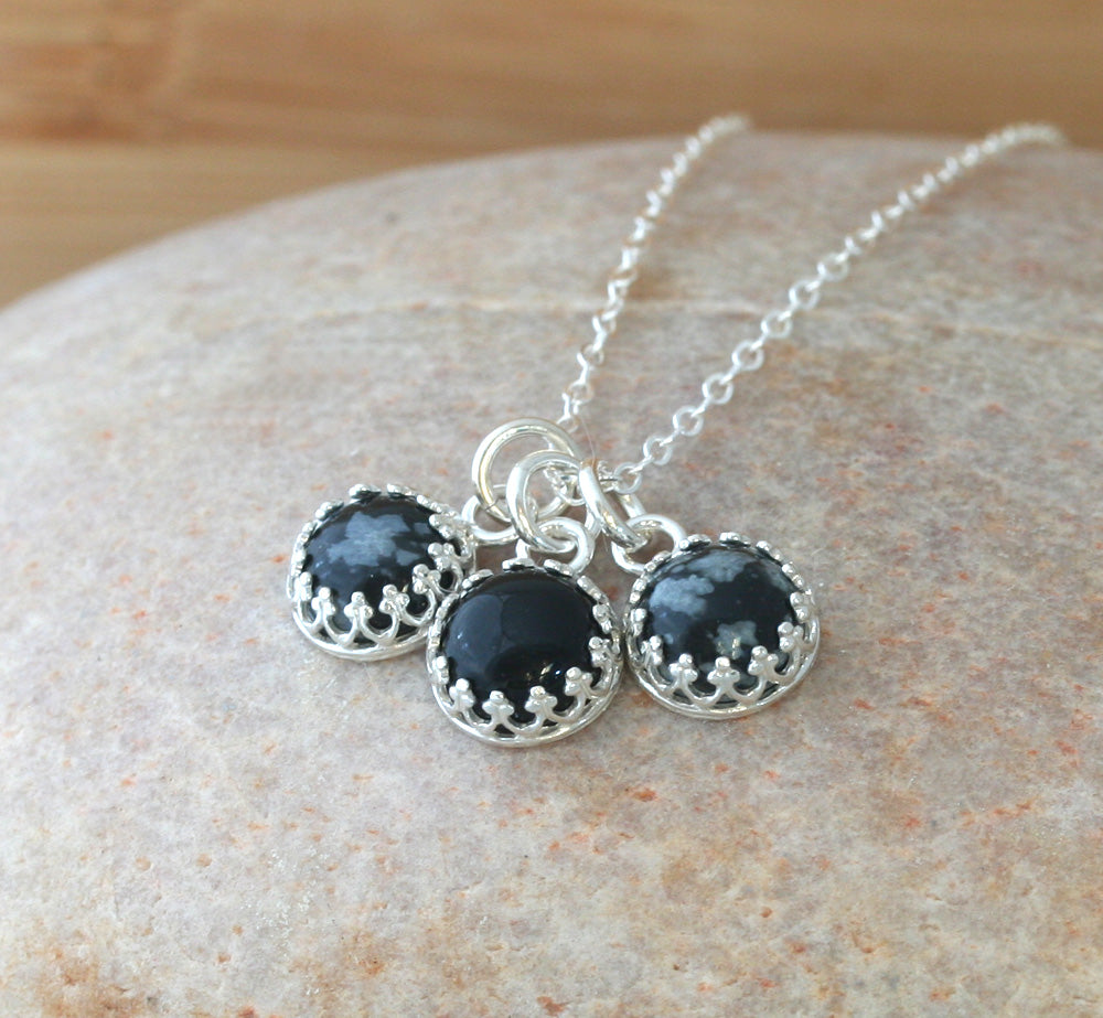 Snowflake and black onyx crown necklace in sustainable sterling silver. Handmade in New Jersey, US.