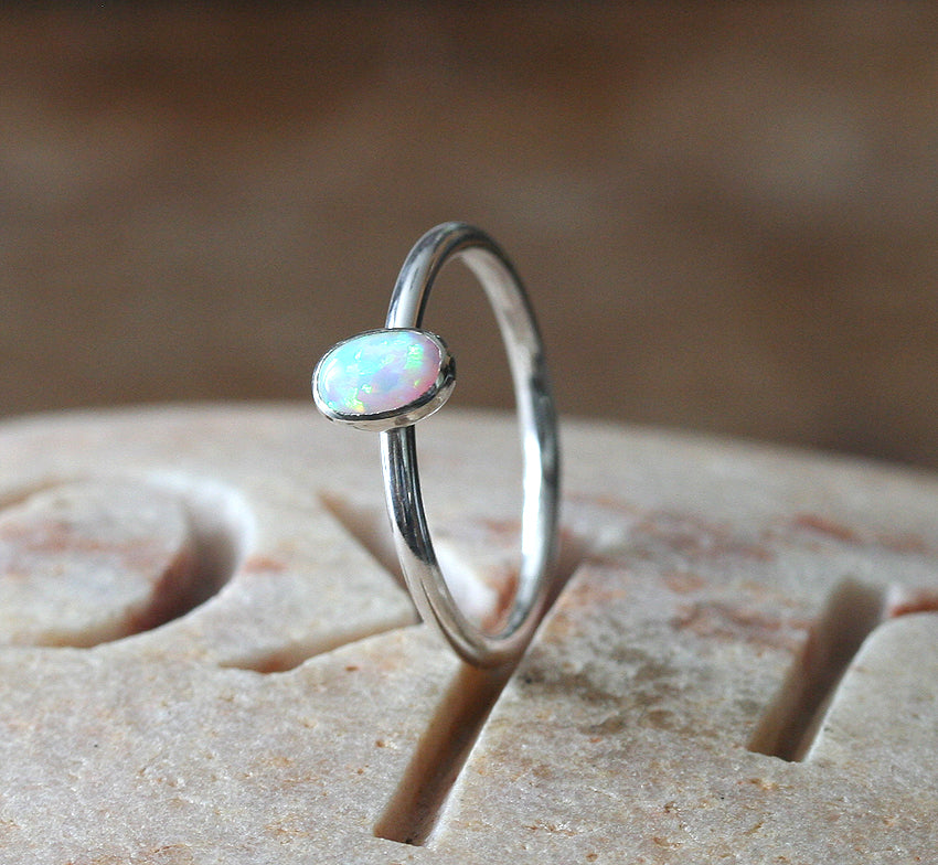 White oval opal stacking ring handmade in New Jersey, US., with ethical silver. Minimalist stacker.