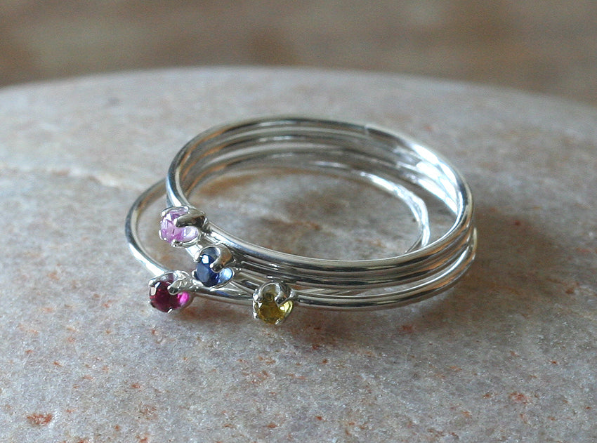 Thin faceted birthstone stacking rings in sustainable silver. Handmade in New Jersey, US.