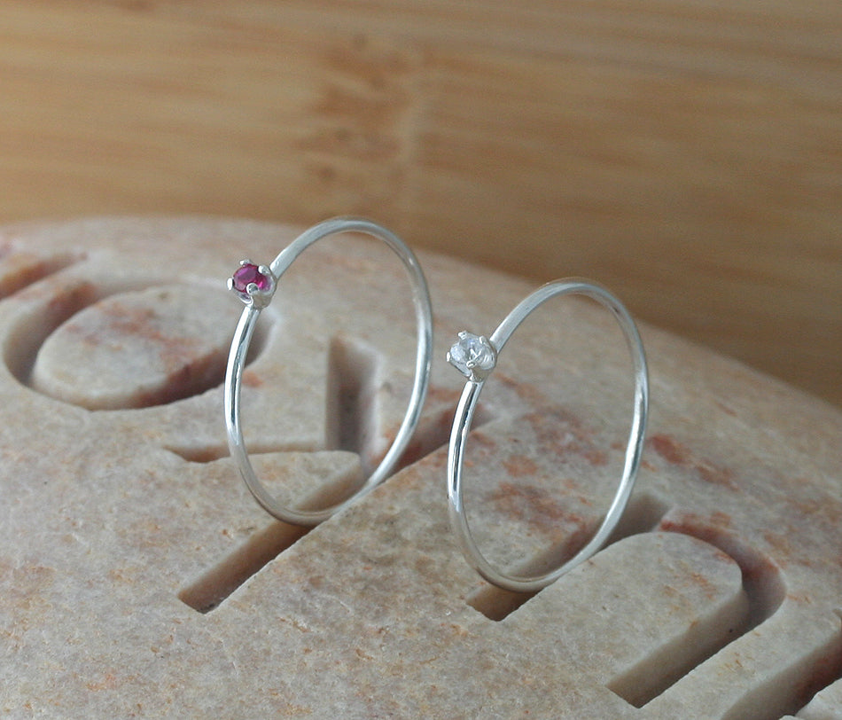 Thin faceted birthstone stacking rings in sustainable silver. January and April. Handmade in New Jersey, US.