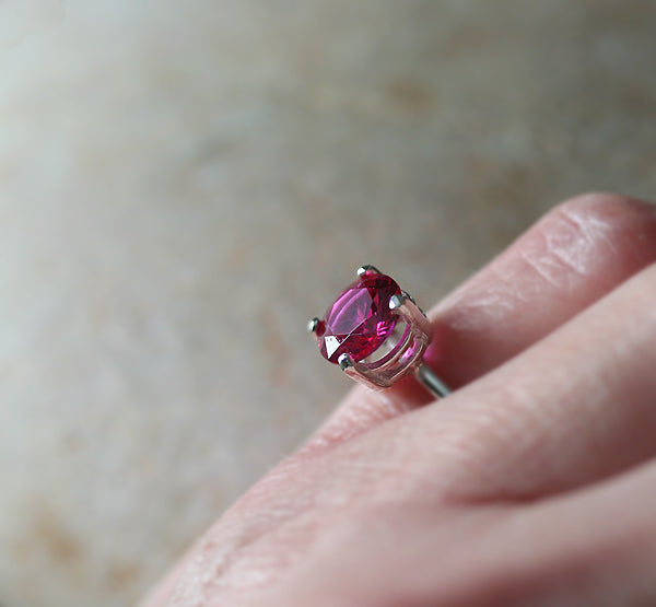 Ruby faceted prong ring in sustainable sterling silver. Ethical ruby on finger. Handmade in New Jersey, US.