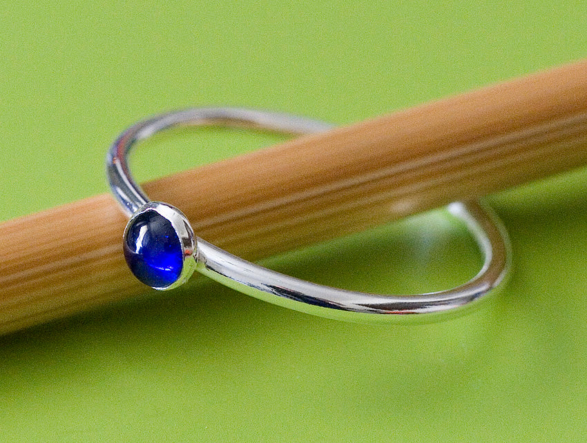 Ethical blue sapphire stacking ring in sterling silver. Handmade in the US.