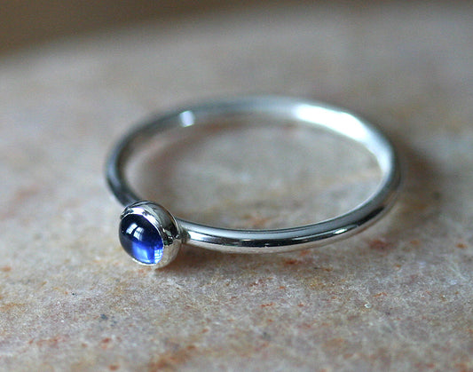 Ethical blue sapphire stacking ring in sterling silver. Handmade in the US.