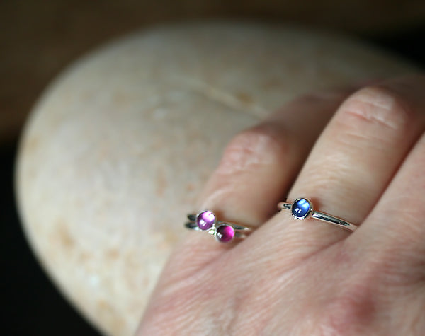 Ethical blue and pink sapphire stacking rings in sterling silver. Handmade in the US.