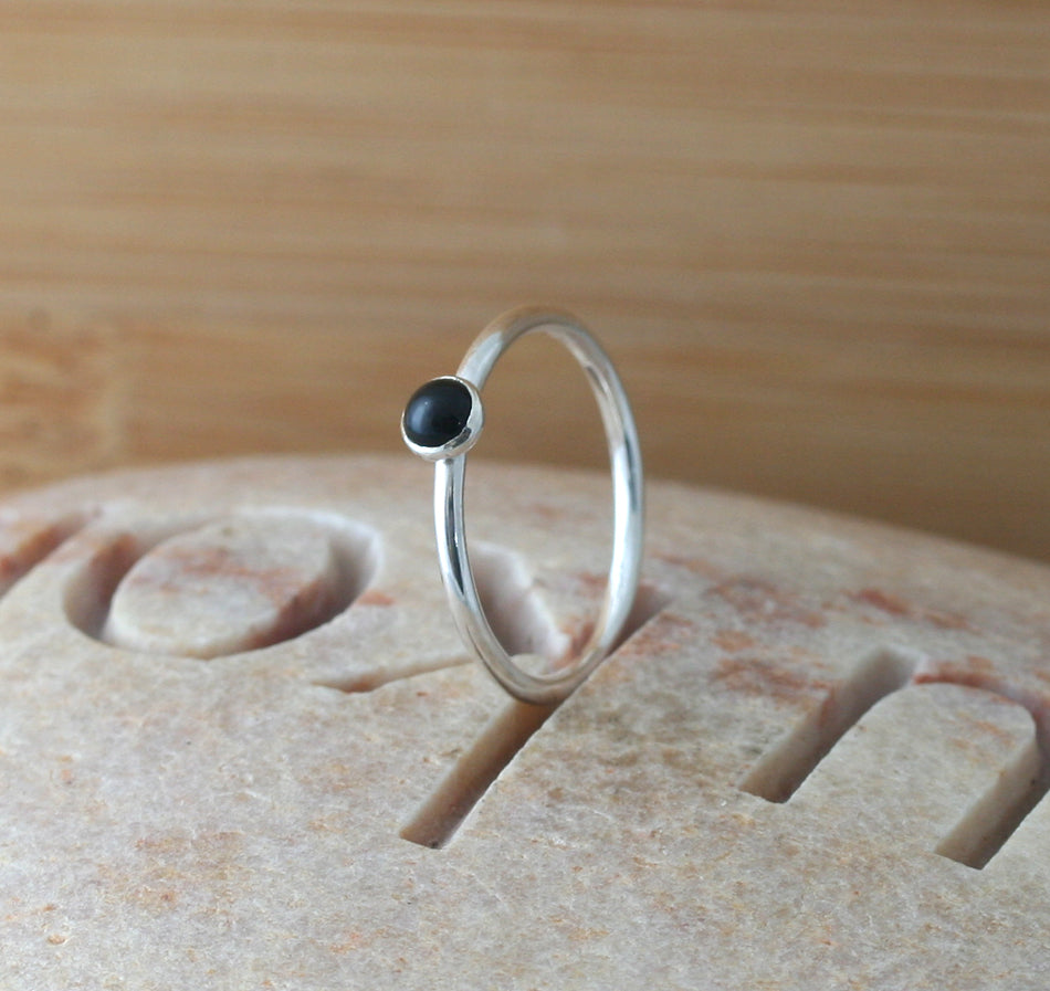 Small black onyx stacking ring in all sizes. Sterling silver. Minimalist design. Handmade in the US with sustainable silver.