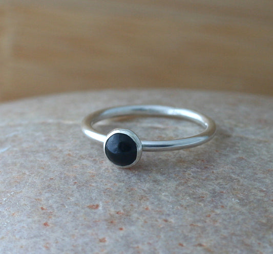 Small black onyx stacking ring in all sizes. Sterling silver. Minimalist design. Handmade in the US with sustainable silver.
