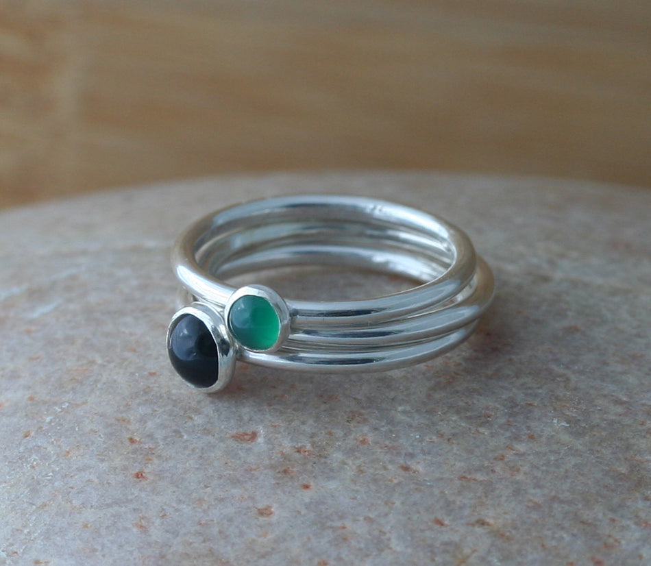Stacked small black and green onyx stacking rings with plain stacking ring in all sizes. Sterling silver. Minimalist design. Handmade in the US with sustainable silver.