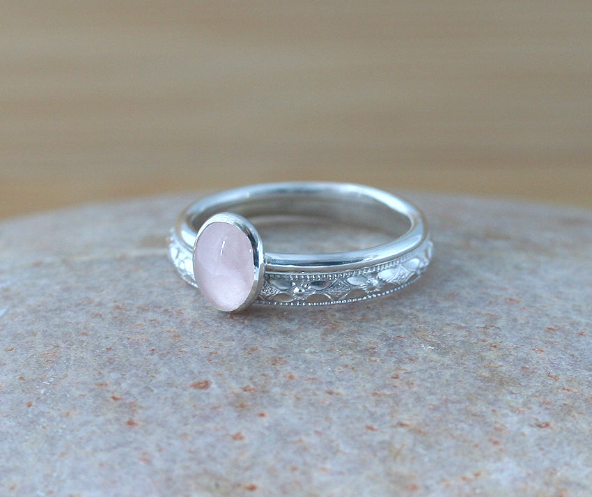 Floral and rose quartz stacking rings in sustainable sterling silver