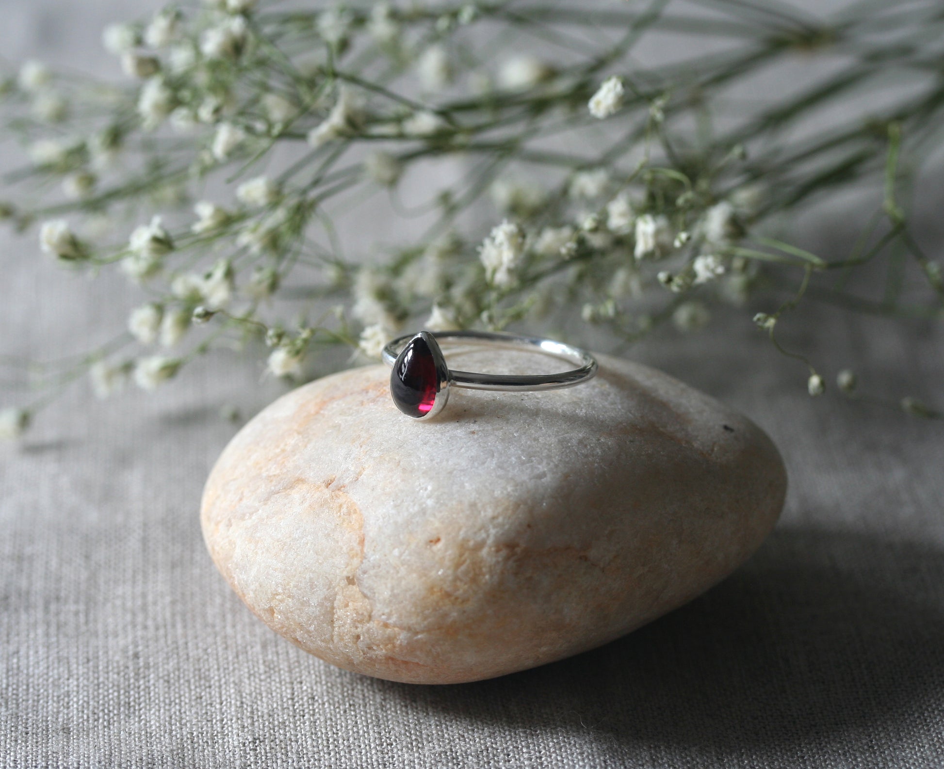 Garnet tear drop ring in sterling silver. Handmade with ethical sterling silver in New Jersey, US.. Hygge garnet ring.