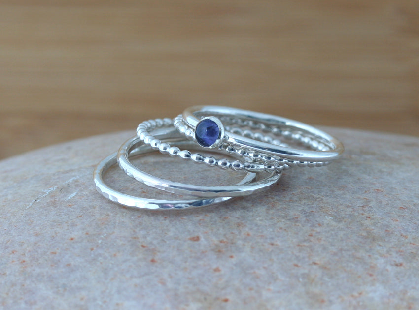 Small iolite stacking ring and textured stacking rings in all sizes. Sterling silver. Minimalist design. Handmade in the US with sustainable silver.