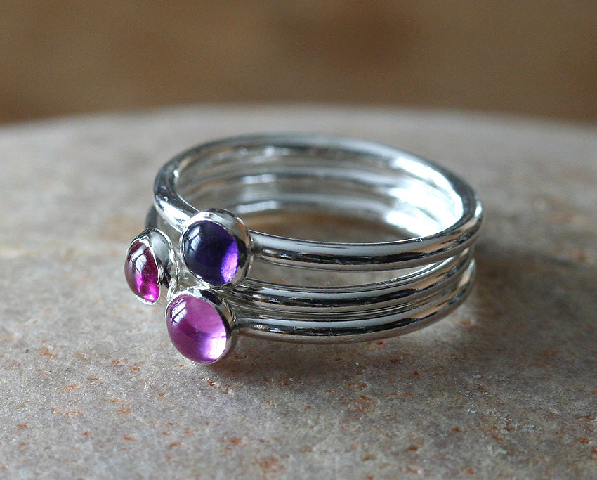 Ruby, amethyst, pink sapphire birthstone stacking rings in sustainable sterling silver. Handmade in New Jersey, US.