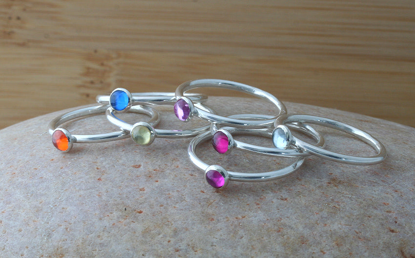 Bright birthstone stacking rings in sustainable sterling silver. Handmade in New Jersey, US.