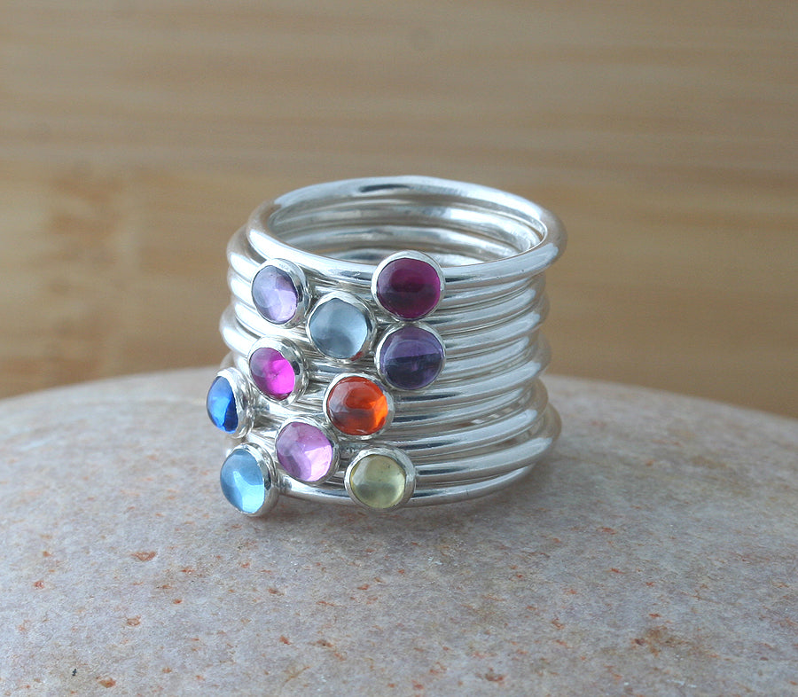 Ethical birthstone stacking rings stacked.