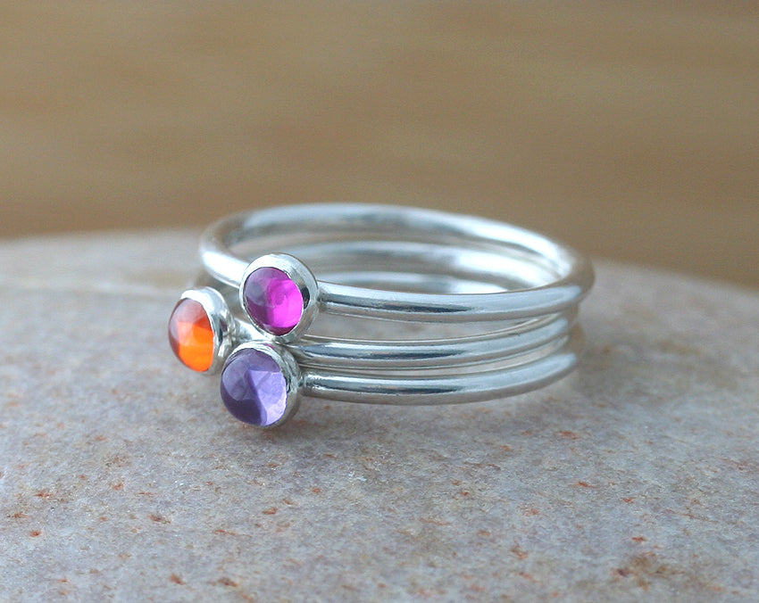 Ruby, alexandrite, and orange cz stacking rings in sustainable sterling silver. Ethical rings. Handmade in New Jersey, US.