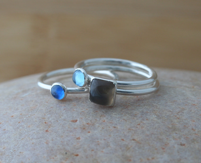 Ethical blue stacking rings and quartz square ring in sterling silver.