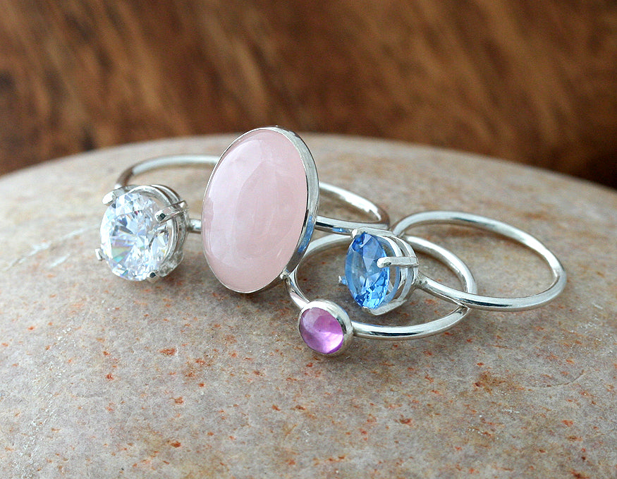 Pink sapphire, rose quartz, cubic zirconia stacking rings. Sterling silver. Handmade in the US with sustainable silver.