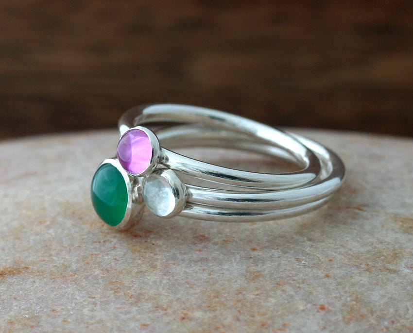 Quartz crystal, pink sapphire, and green onyx stacking rings. Sterling silver. Handmade in the US with sustainable silver.