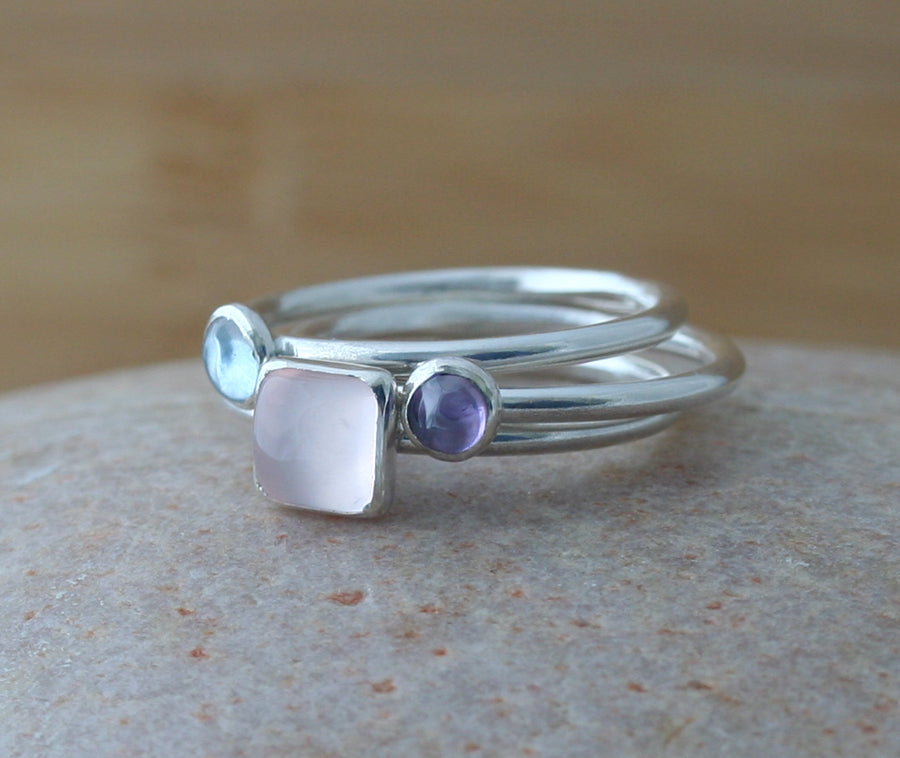 Rose quartz square stacking ring with aquamarine and alexandrite stacking rings. Sterling silver. Handmade in the US with sustainable silver.