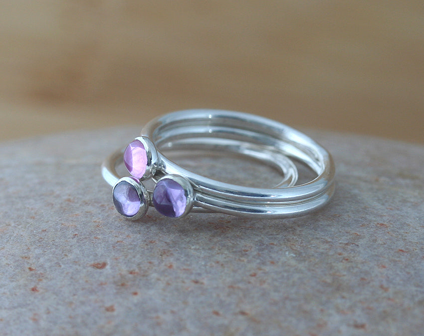 Purple and pink stacking rings in sustainable sterling silver. handmade in the US.