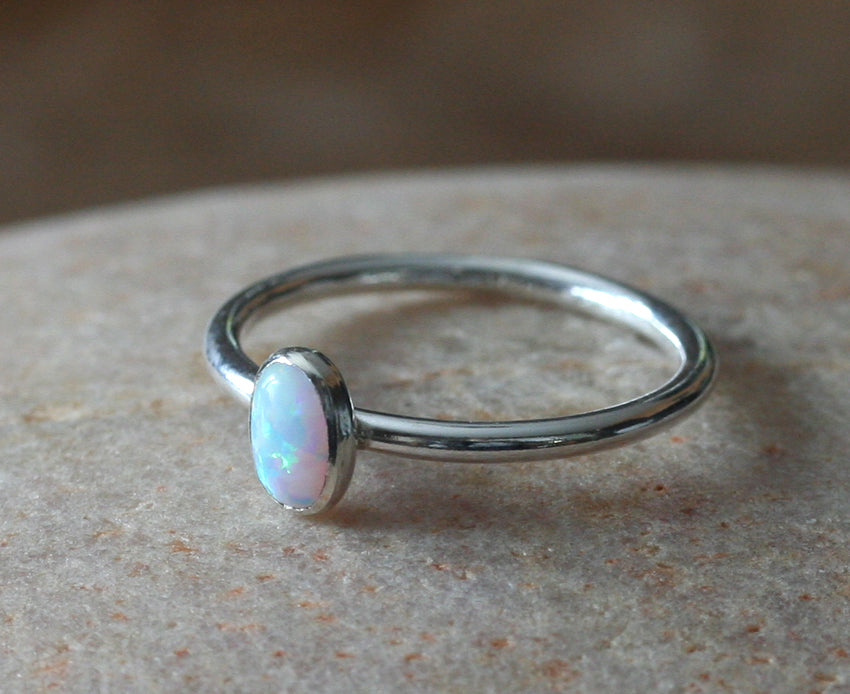 White oval opal stacking ring handmade in New Jersey, US., with ethical silver. Minimalist stacker.