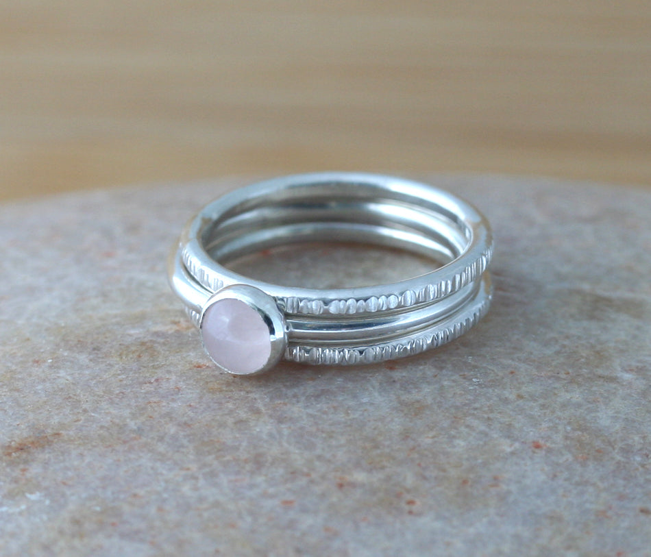 Small rose quartz stacking ring with tree bark stackers . Sterling silver. Minimalist design. Handmade in the US with sustainable silver.