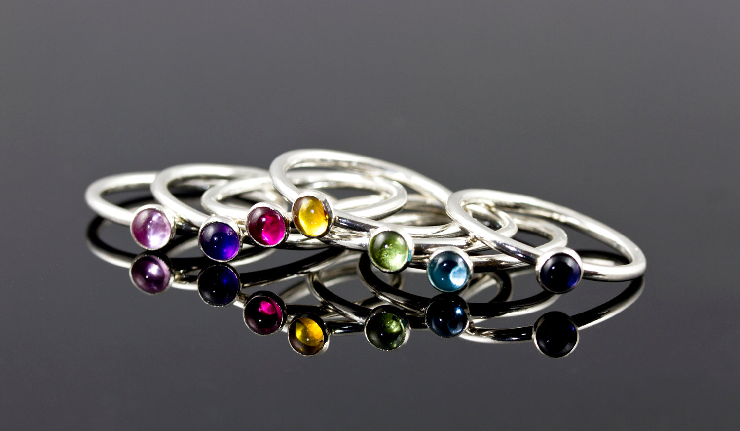 Birthstone stacking rings in sterling silver. Handmade in the US with sustainable silver.