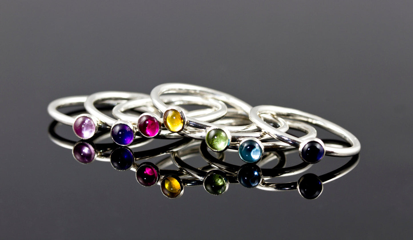 Colorful birthstone stacking rings. Sterling silver. Handmade in the US with sustainable silver.