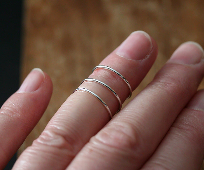 Thin midi stacking rings on finger. Sustainable sterling silver. Handmade in New Jersey, US.