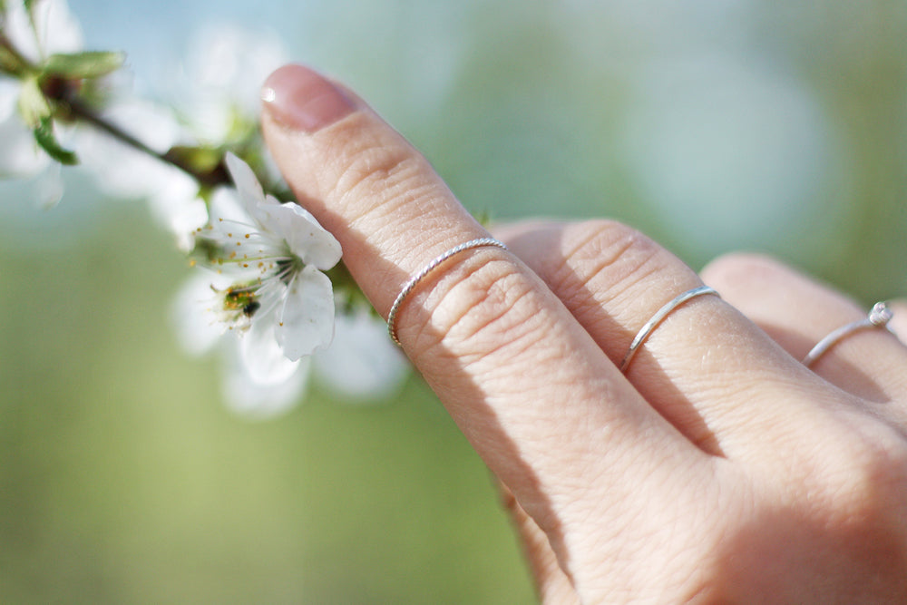 Thin twisted stacking ring in sustainable sterling silver. Handmade in New Jersey, US.