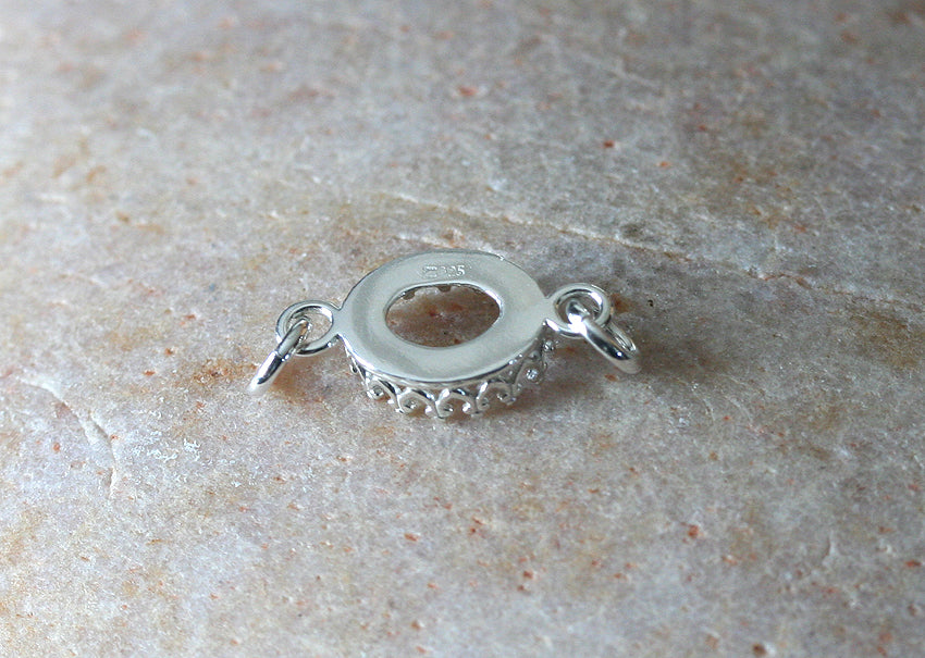 Oval crown princess bezel cup pendant in sustainable sterling silver with jump rings. 8 x 10 mm. Jewelry blank supplies.